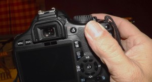 Back of a DSLR camera showing back button focussing technique