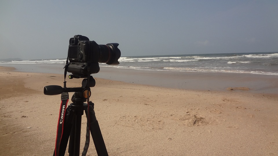 DSLR Camera on a tripod on a deserted beach